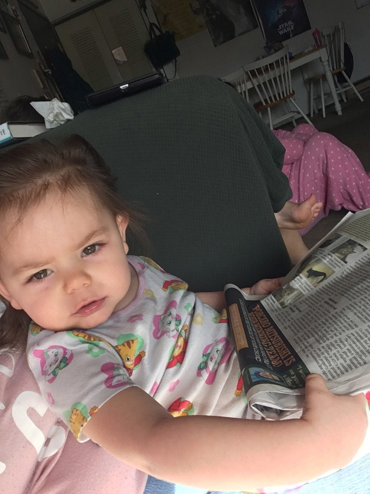 baby with newspaper